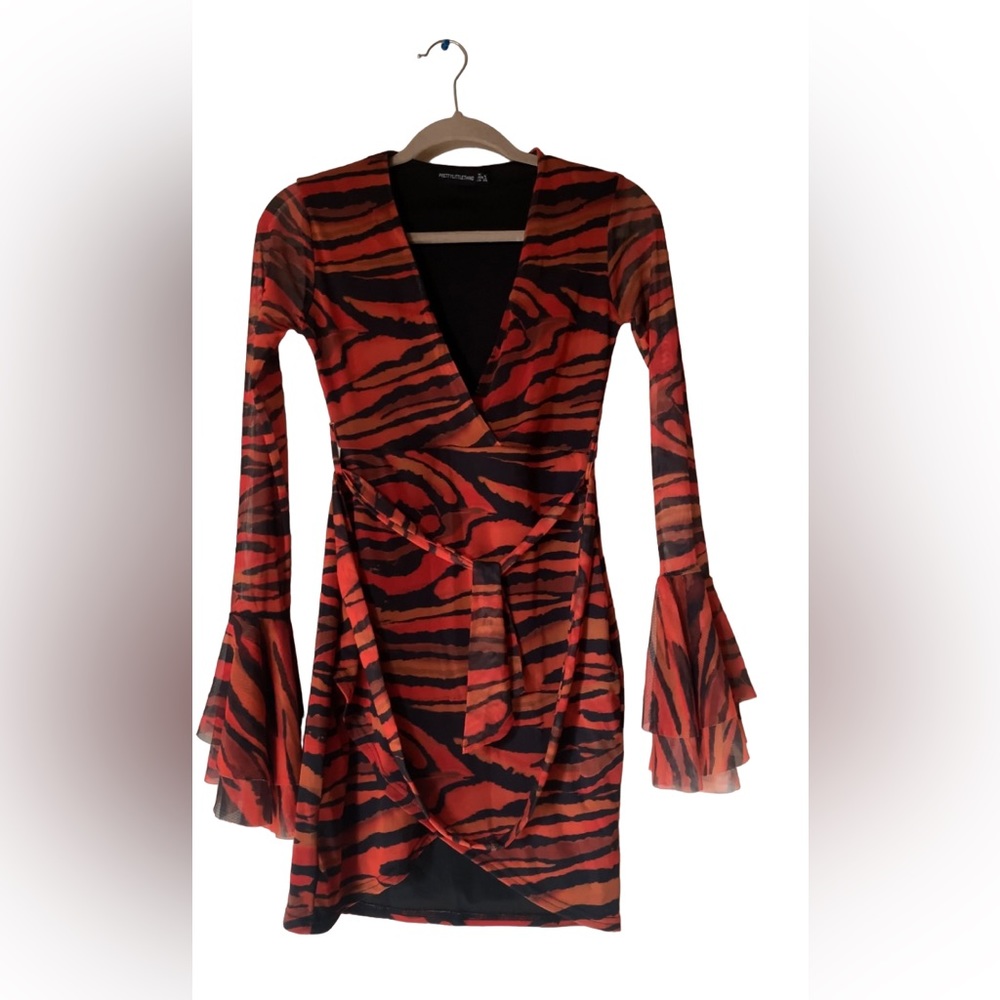 Zebra print mesh flared sleeve dress, with a waist tie. Never worn